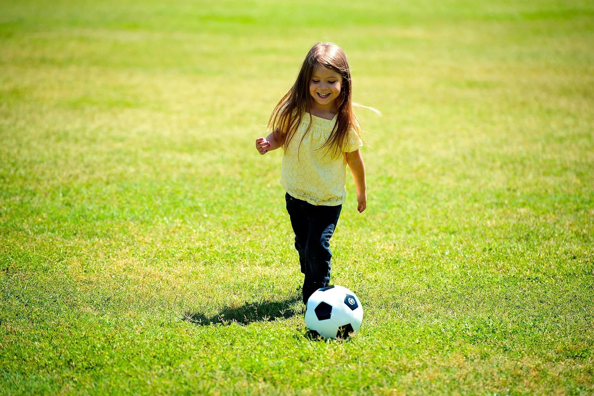 A kicking a soccer ball